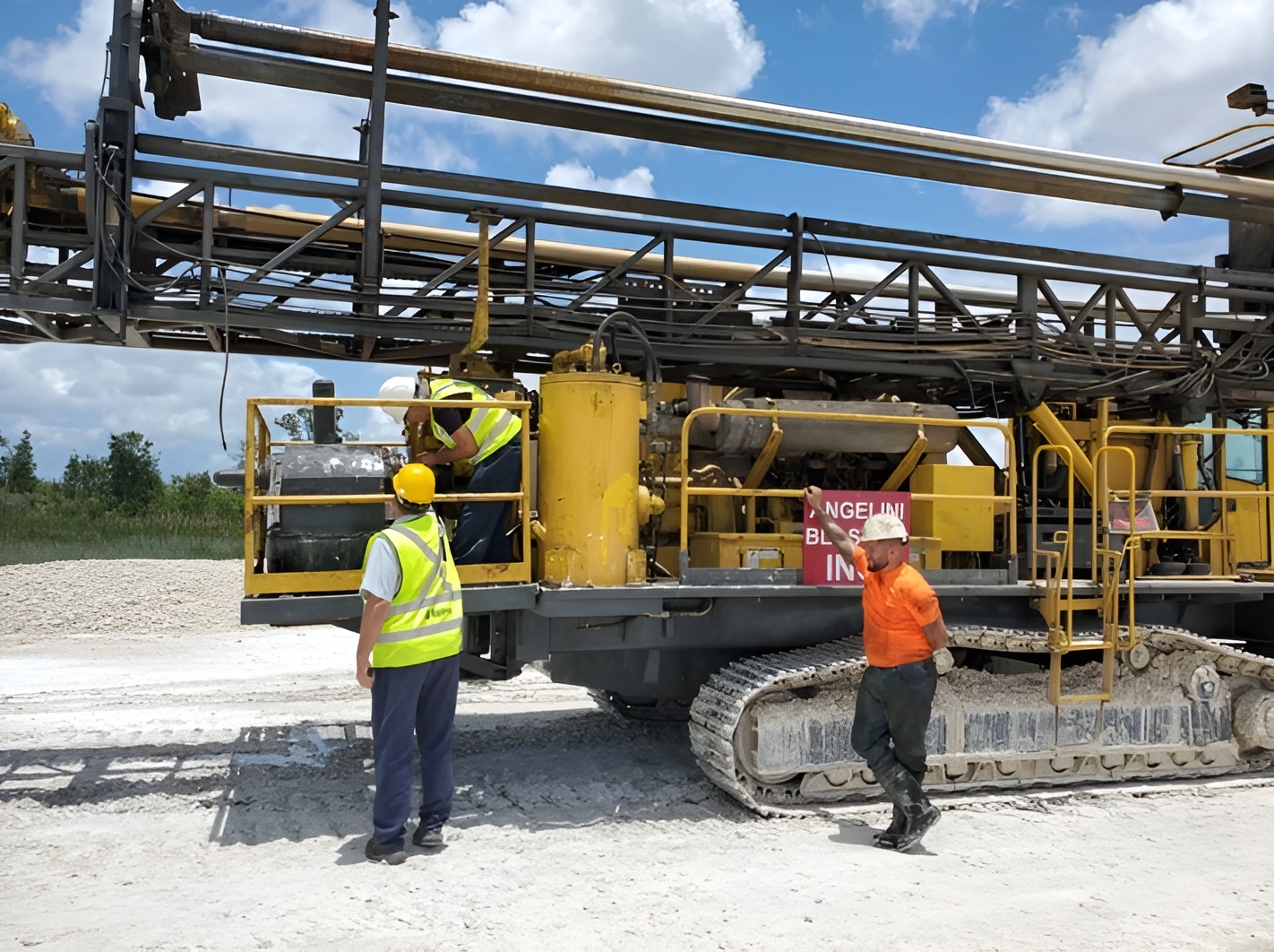 Mining spare parts supplier and operations manager reviewing equipment fleet inventory and replacement parts framework at an industrial facility
